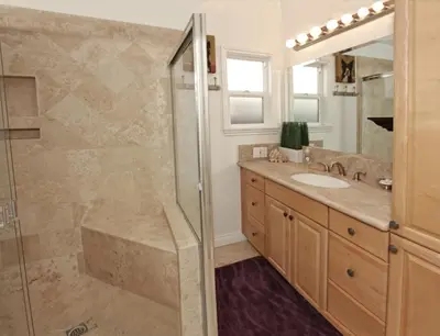 a bathroom with a shower and a sink at Lower West Newport in Newport Beach