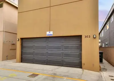a pair of garage doors on the side of a building at 3 Bedrooms in Newport Beach