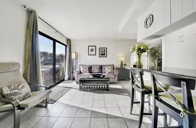 a living room with a couch and a table at 3 Bedrooms in Newport Beach