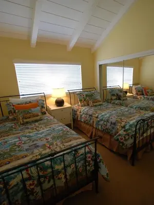 a bedroom with two beds and a window at 3112 W Oceanfront B in Newport Beach