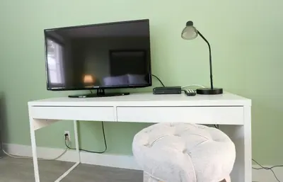 a white desk with a television and a chair at PRIVATE La Jolla Guest Suite in San Diego