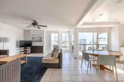 a living room with a couch and a table at Alexander - Oceanview in Newport Beach
