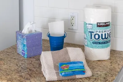 a counter with a roll of paper towels and a bag of toothpaste at Benjamin - Oceanview in Newport Beach
