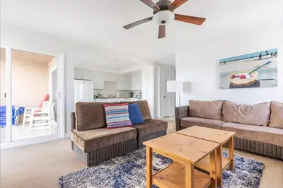 a living room with a couch and a table at Benjamin - Oceanview in Newport Beach