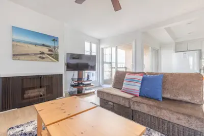 a living room with a couch and a coffee table at Benjamin - Oceanview in Newport Beach