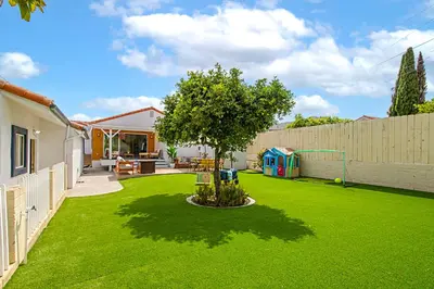 a yard with a tree and a playground at The Gathering Place - Guest Favorite with Huge Yard in San Diego