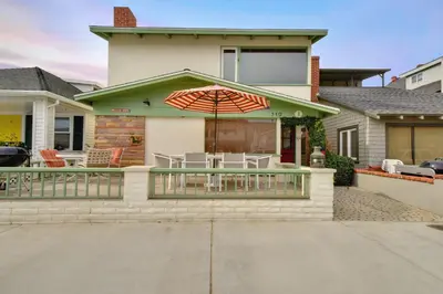 a house with a patio with an umbrella at 319 Coronado in Newport Beach