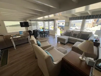 a living room with couches and a dining room at 327 Alvarado Pl in Newport Beach