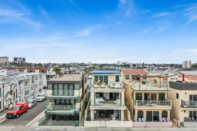 an apartment building with a view of a city at 3312 W Oceanfront in Newport Beach