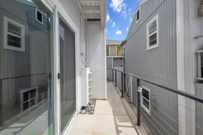 a balcony with a view of a building at The Shining Sea Crab in Oceanside