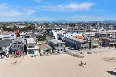 an aerial view of a city with houses and a beach at 3600 W Oceanfront in Newport Beach