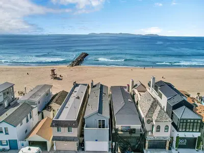 an aerial view of a beach with houses and the ocean at 3607 Seashore Dr B in Newport Beach