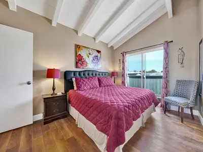 a bedroom with a large bed and a window at 3607 Seashore Dr B in Newport Beach