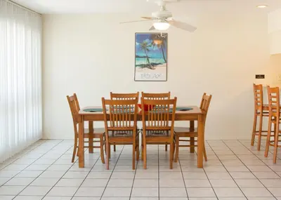 a dining room with a table and chairs at 3610 Seashore Dr in Newport Beach