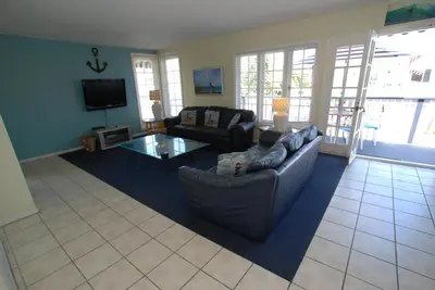 a living room with a couch and a coffee table at 4210 Seashore Dr in Newport Beach