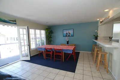 a kitchen and dining room with a table and chairs at 4210 Seashore Dr in Newport Beach