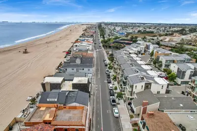 an aerial view of the beach and buildings at 5408 Seashore Dr A in Newport Beach