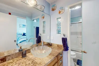 a bathroom with two sinks and a toilet at Tranquil Escape Bayside in San Diego