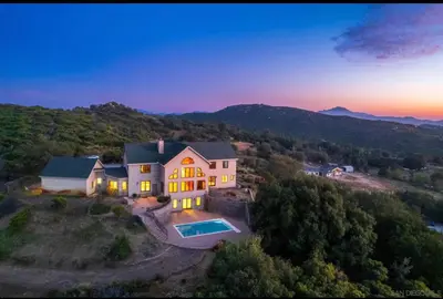 an aerial view of a house with a swimming pool at Sunset-Ridge in Alpine