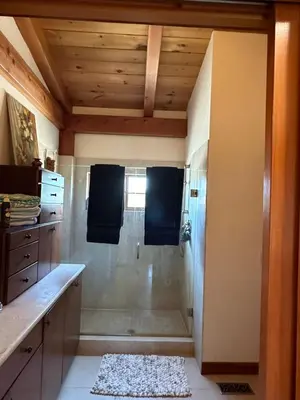 a bathroom with a shower with a glass door at Sunset-Ridge in Alpine