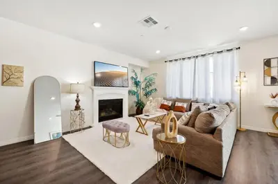 a living room with a couch and a fireplace at Entire Private Home with 5 Bedrooms 3 Bathrooms, 3000 sqft, Gated Yard, Garage, Nice View, Available Now in Menifee