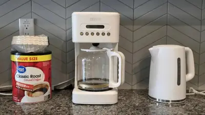 a white blender sitting on a counter next to a coffee maker at Entire Private Home with 5 Bedrooms 3 Bathrooms, 3000 sqft, Gated Yard, Garage, Nice View, Available Now in Menifee