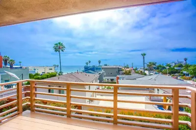 a balcony with a view of the ocean at Steps 2 Ocean & Surfing Ocean Views Rooftop Deck in San Diego