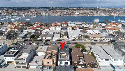 an aerial view of a city with a red arrow at 1225 W Balboa Blvd B in Newport Beach
