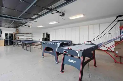 a room with ping pong tables and a net at Grenache Estate - Nestled in Temecula Wine Country in Temecula