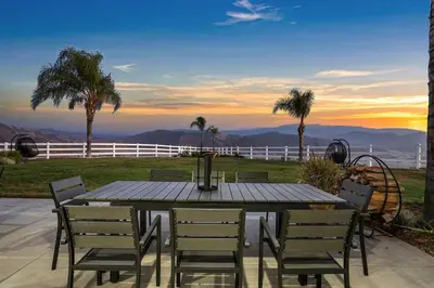 a table and chairs with a view of the mountains at Grenache Estate - Nestled in Temecula Wine Country in Temecula