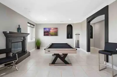 a large room with a pool table and a fireplace at Grenache Estate - Nestled in Temecula Wine Country in Temecula