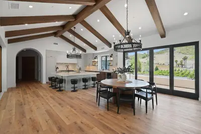 a kitchen and dining room with a table and chairs at Villa Rosa in Temecula
