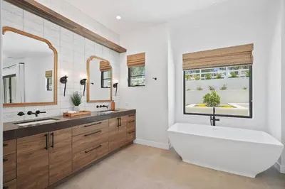 a bathroom with a large tub and a large window at Villa Rosa in Temecula