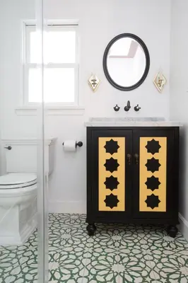 a bathroom with a vanity with a mirror and a toilet at Casa Laguna Hotel & Spa in Laguna Beach