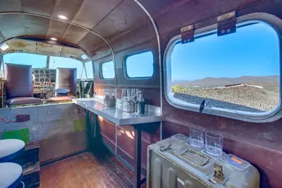 an inside view of a train car with two windows at Fallbrook Airplane Home with Fire Pit and Mtn Views! in Temecula