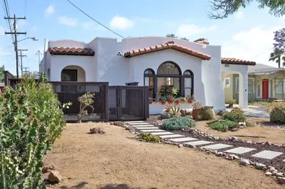 a house with a gate in front of it at Spanish Casa near zoo and beach with sun deck and AC in San Diego
