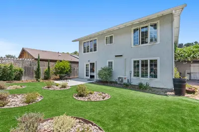 a house with a yard with green grass at Restful Retreat - Vibrant - Tranquil Yard in San Diego