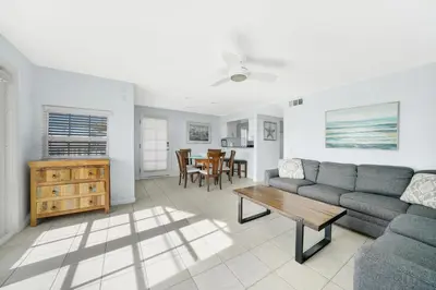 a living room with a couch and a table at 1404 W Oceanfront B in Newport Beach
