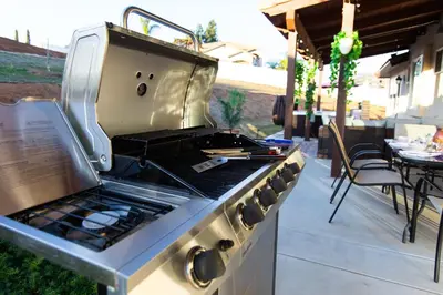 a stove top oven sitting on a patio at Amethyst Hearth - Family Spa Serenity, Zoo, Beach, Disneyland, Legoland in Vista