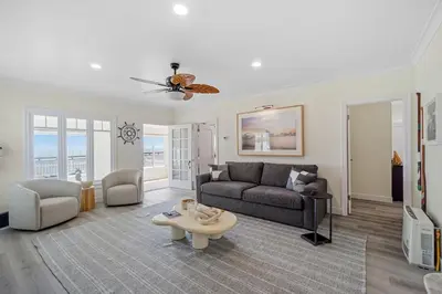 a living room with a couch and a table at Carlsbad Blvd Villa in Carlsbad
