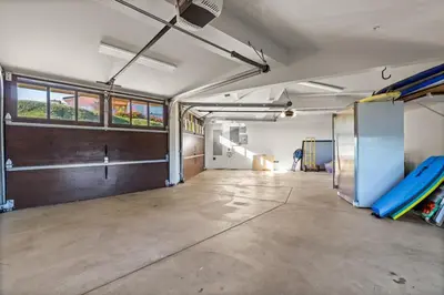 an empty room with a room with surfboards in it at Dana Point Luxe in Dana Point
