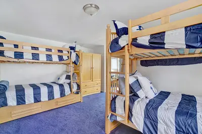two bunk beds in a room with at 122 Thirty Third Street in Newport Beach