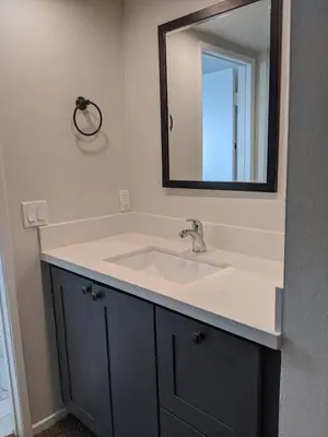 a bathroom with a sink and a mirror at 124 Thirty Fourth Street B in Newport Beach