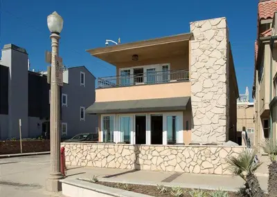a building with a street light in front of it at 2314 W Oceanfront A & B in Newport Beach