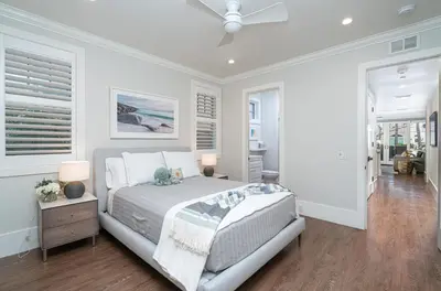 a bedroom with a bed and a ceiling fan at 1225 W Balboa Blvd A & B in Newport Beach