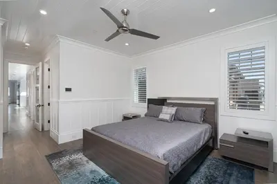 a bedroom with a bed and a ceiling fan at 1225 W Balboa Blvd A & B in Newport Beach