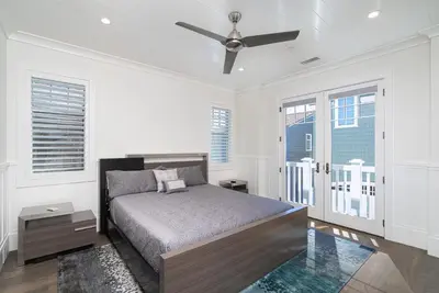 a bedroom with a bed and a ceiling fan at 1225 W Balboa Blvd A & B in Newport Beach