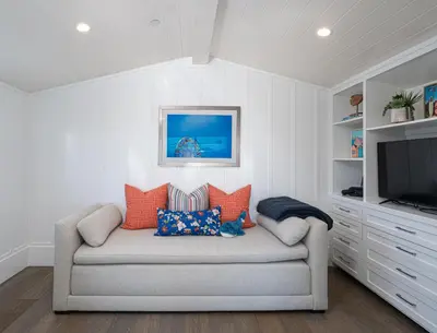 a living room with a couch and a television at 1225 W Balboa Blvd A & B in Newport Beach