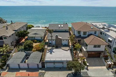 an aerial view of a house with the ocean at Neptune Sunset Shores Oceanfront in Encinitas