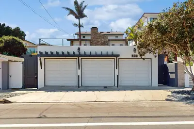 a pair of garage doors in front of a house at Neptune Sunset Shores Oceanfront in Encinitas